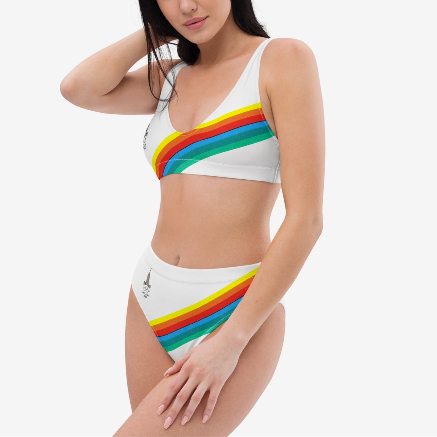 Young fit girl wearing white retro Soviet Olympics bikini set with Moscow 1980 Olympic Games logo - side