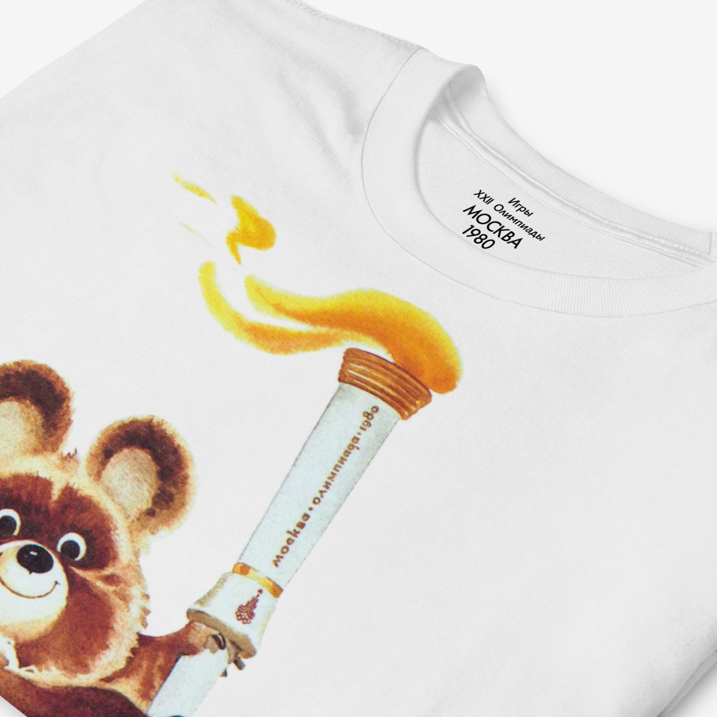 Misha the Olympic Bear T-shirt featuring the iconic 1980 Moscow Olympics design with the Olympic torch, celebrating Soviet sports history.