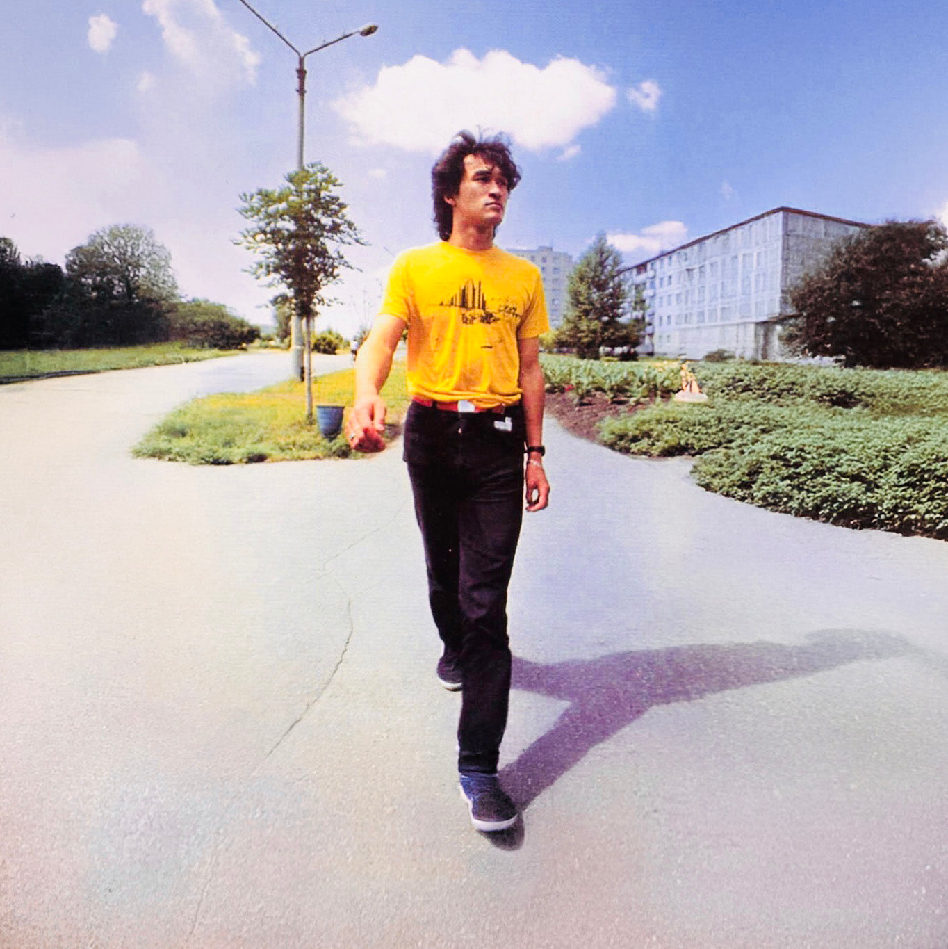 Rare archival photo of Viktor Tsoi in a yellow T-shirt from GruppaKino.com.