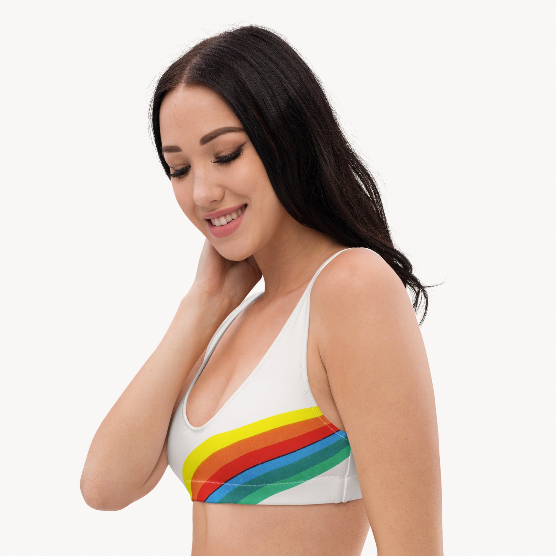 Young fit girl wearing white retro Soviet Olympics bikini top - left side with rainbow print. From www.sovisual.art