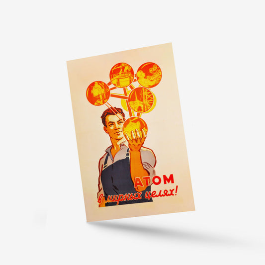 Vintage Soviet postcard featuring a young nuclear scientist and the slogan "Атом в мирных целях!" ("Atom for Peaceful Purposes!") promoting peaceful nuclear energy.