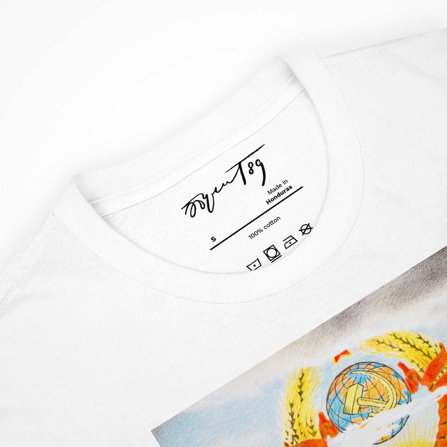 Neck label of a white T-shirt featuring Eric Bulatov's signature for authenticity.