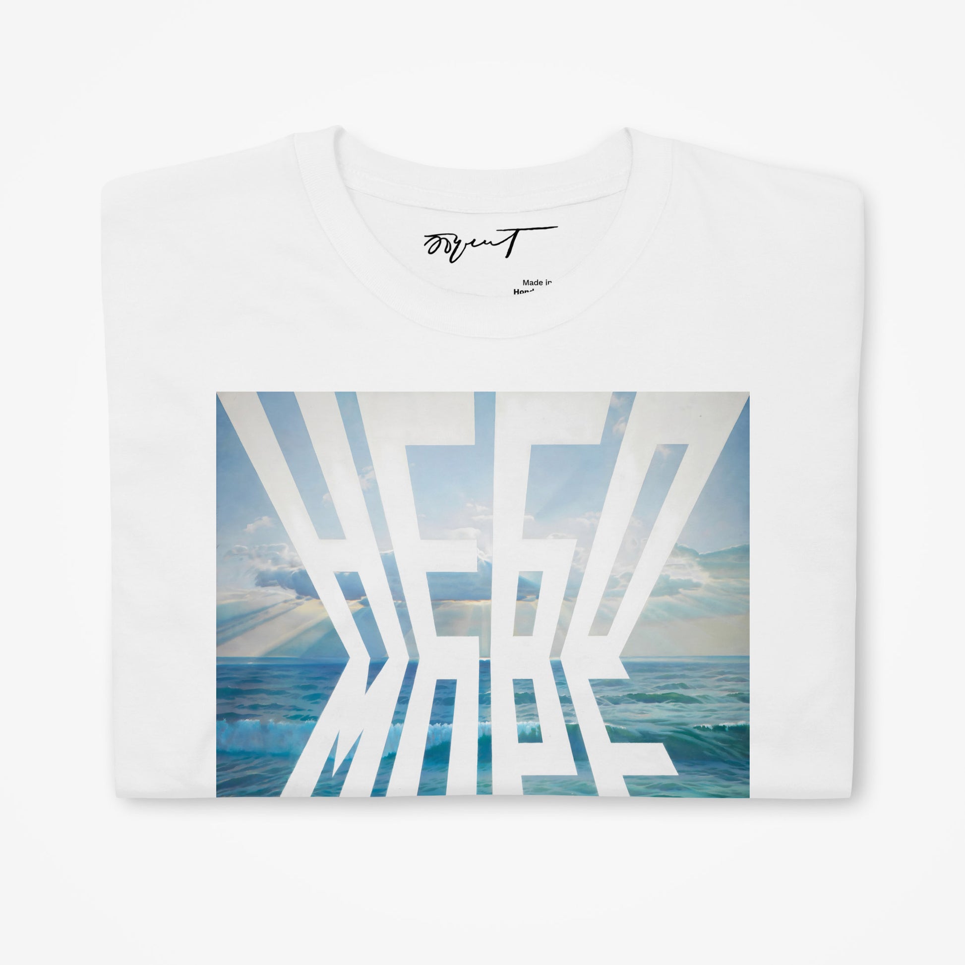 Folded white T-shirt displaying Erik Bulatov's Sky and Sea artwork and premium branding