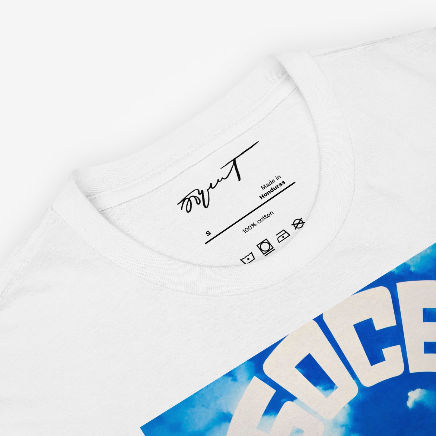 Folded white T-shirt displaying Erik Bulatov’s Небосвод (Sky/Firmament) artwork and premium neck label