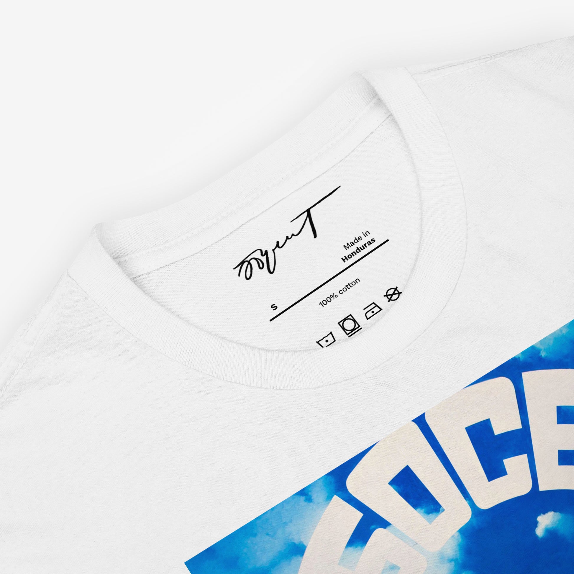 Folded white T-shirt displaying Erik Bulatov’s Небосвод (Sky/Firmament) artwork and premium neck label