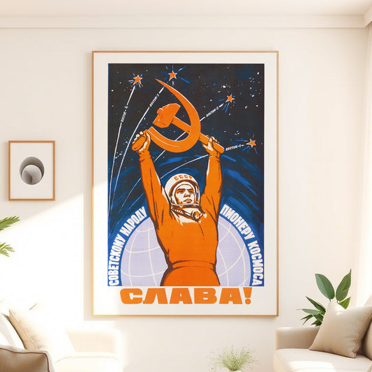 Large Soviet space poster featuring Yuri Gagarin in a cosmonaut suit holding the hammer and sickle, with Vostok rockets launching into space. High-resolution print on premium Japanese paper.