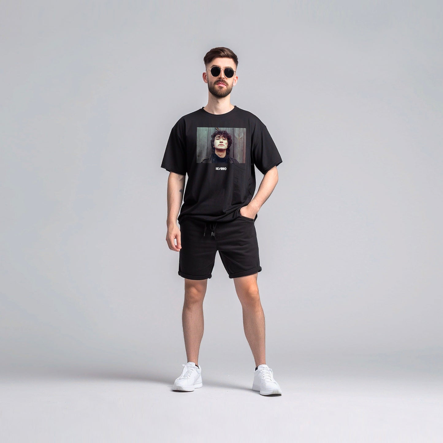 Boy wearing black vintage T-shirt with Viktor Tsoi photo and Gruppa KINO logo
