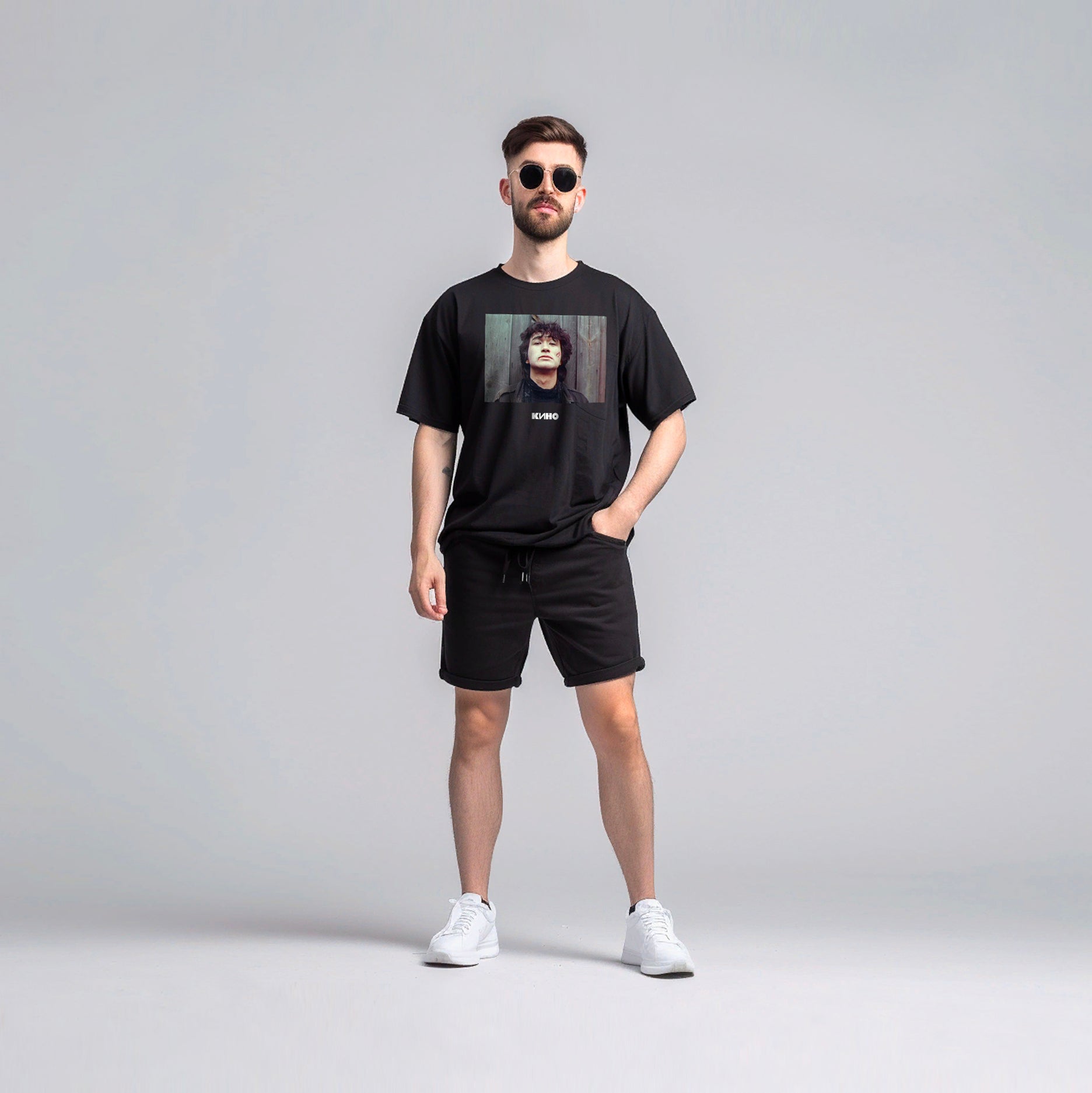 Boy wearing black vintage T-shirt with Viktor Tsoi photo and Gruppa KINO logo