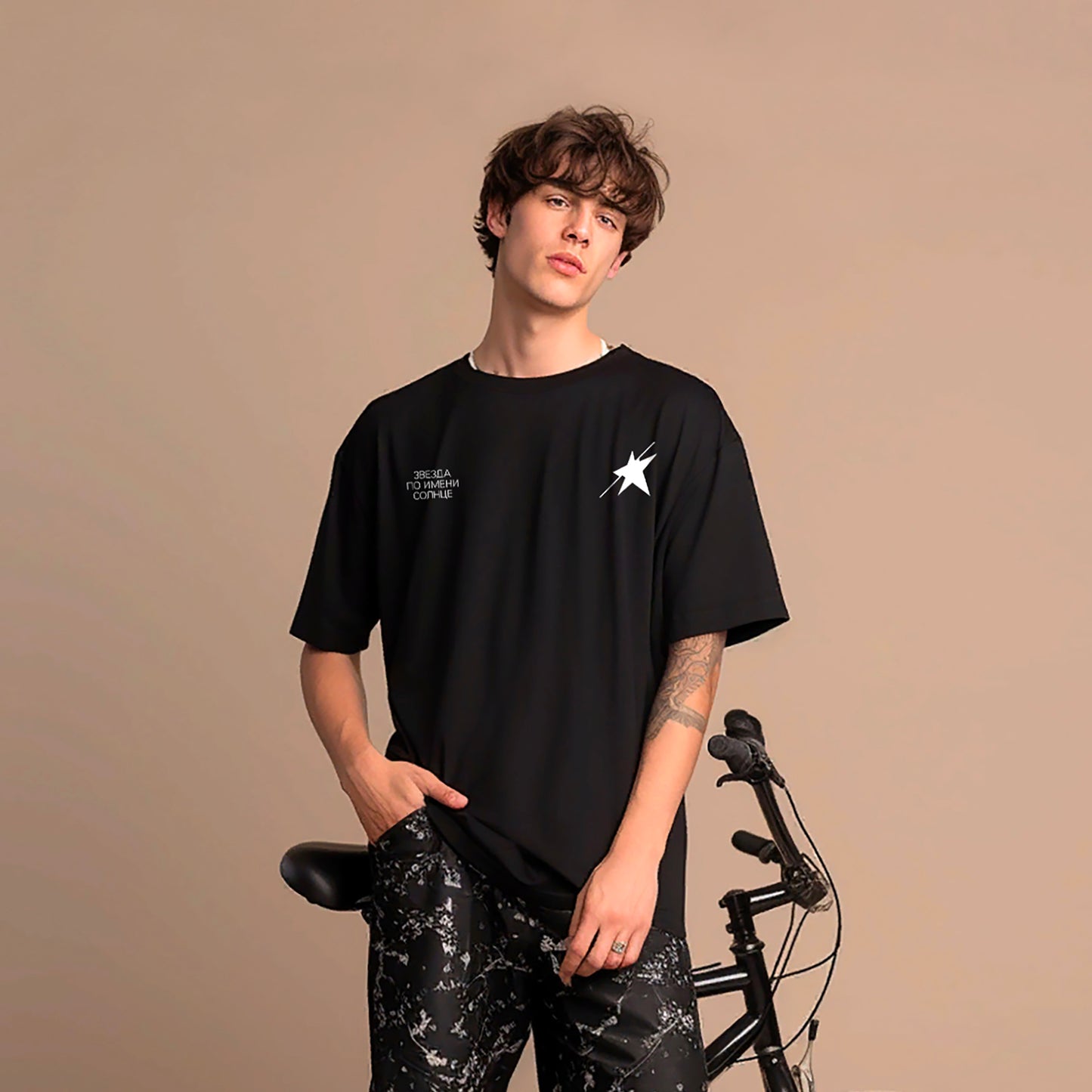 Young boy wearing black unisex KINO Viktor Tsoi t-shirt