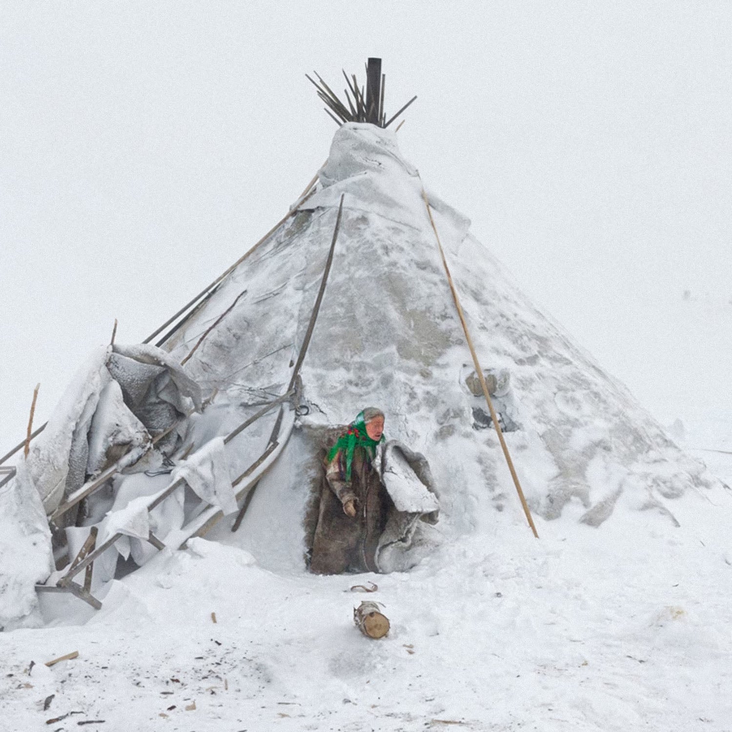 Photo of Nenets woman in traditional clothing near chum tent house in Arctic snow. Closeup photo. Siberian indigenous poster rom www.sovisual.art