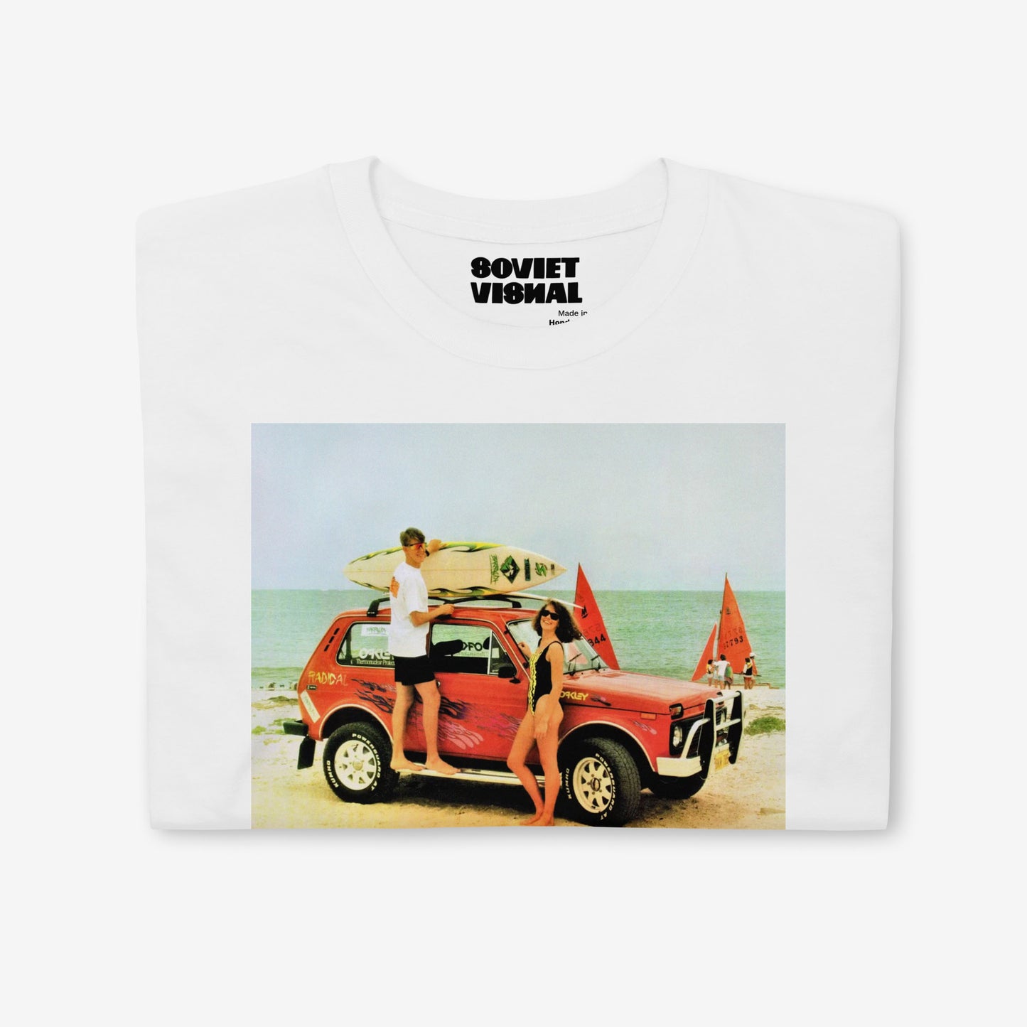White folded T-shirt featuring a classic Niva 4x4 adventure scene, perfect for Soviet car lovers