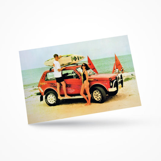 Vintage-style postcard featuring a classic Lada Niva 4x4 parked on a beach