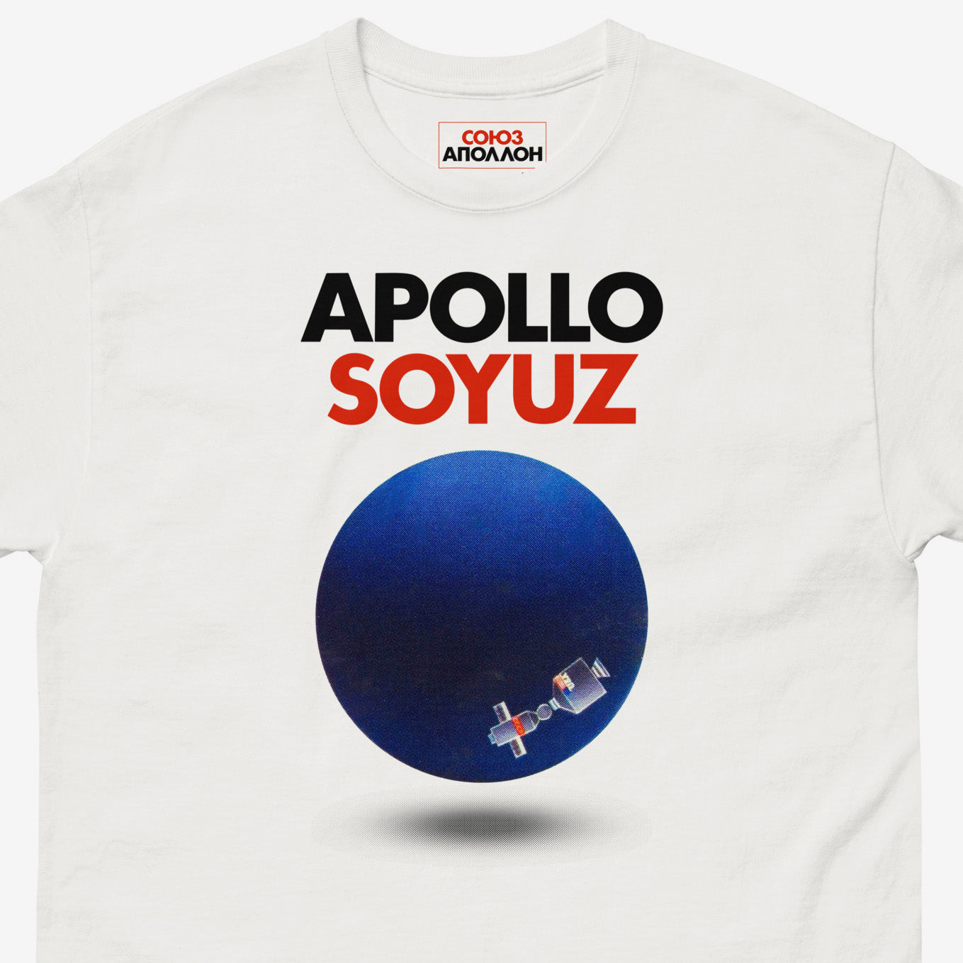 Premium T-shirt with Soyuz Apollo Space Mission logo and planet earth with Space station. Closeup photo. www.sovisual.art