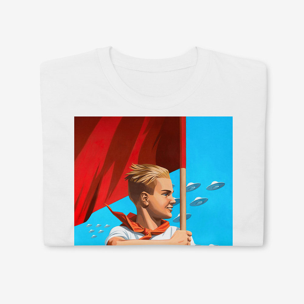T-shirt with artwork of beautiful blonde Soviet pioneer boy holding red flag with UFO flying in blue sky behind him, space-age patriotic design